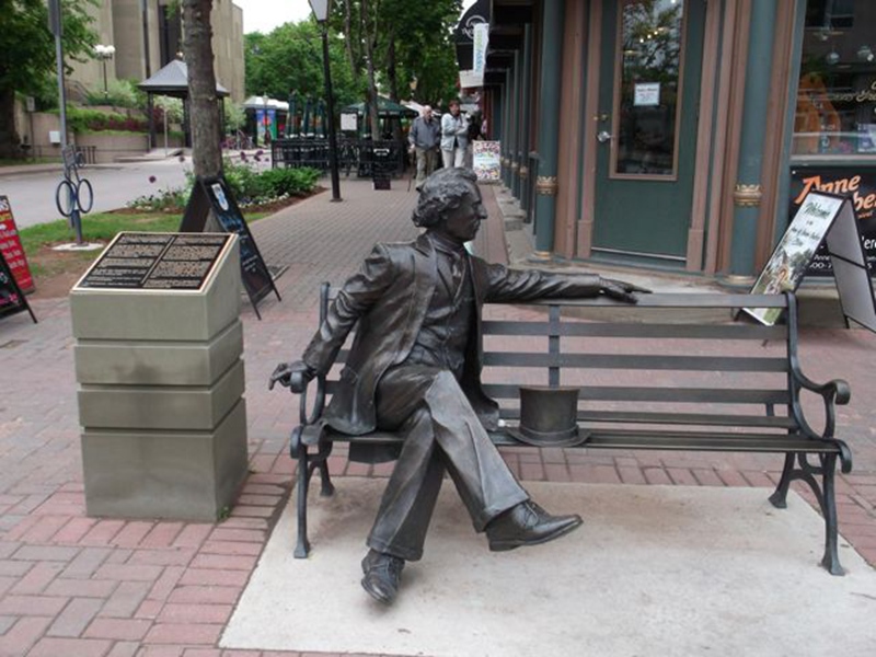 Bronze statue of Sir John A. MacDonald sits on his bench
