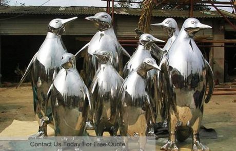 Sculpture stainless steel a group of penguin