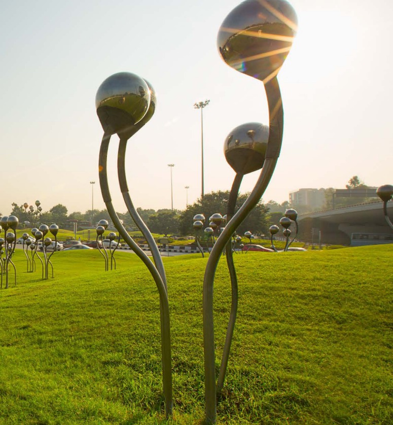stainless steel sprouts sculpture under sun