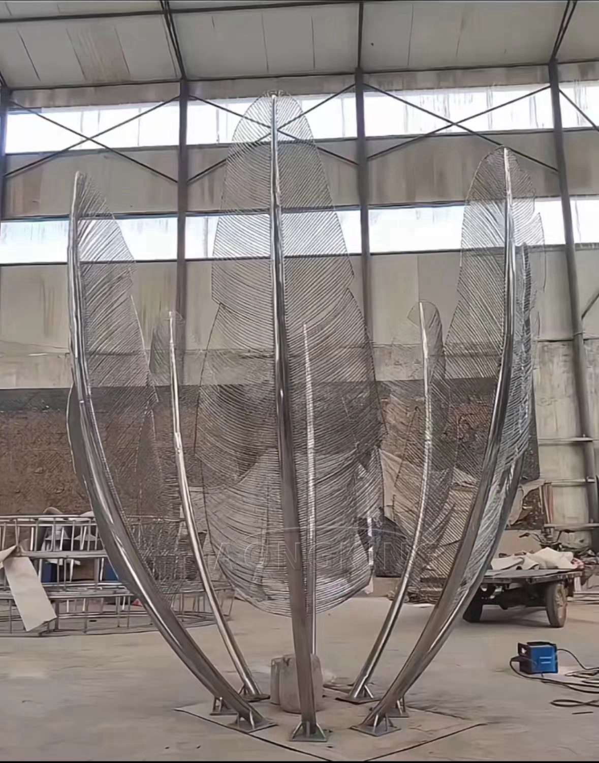 beautiful metal feather art park sculpture