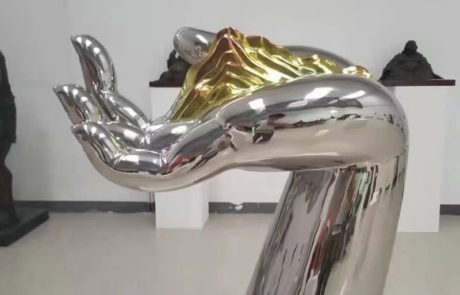 metal sculpture artists gallery mirror hand