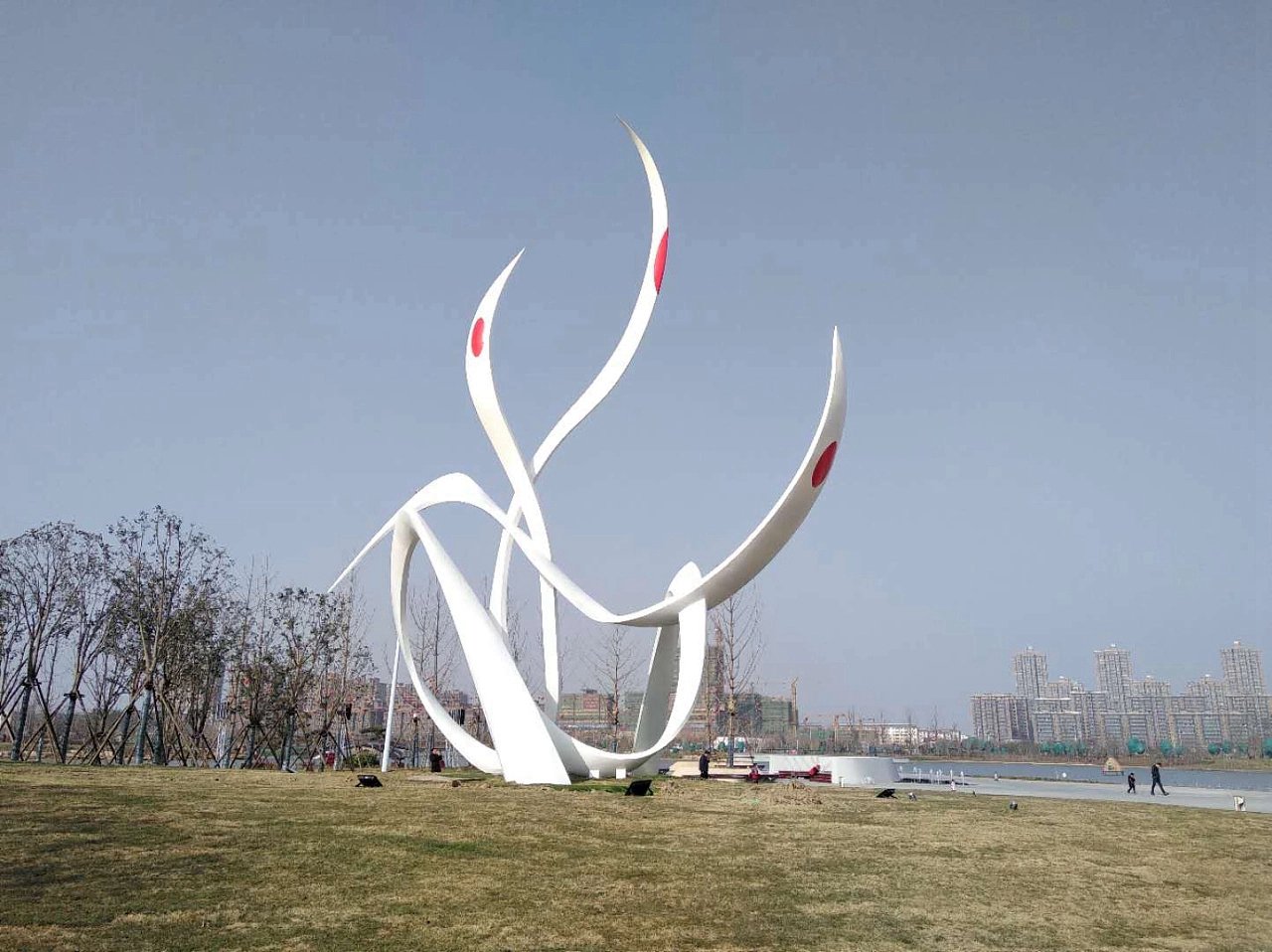 Conceptual stainless steel white metal swan statue