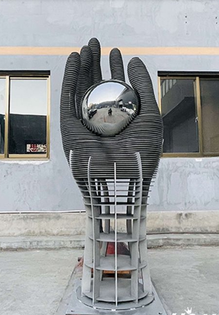 art hold ball hand statue