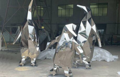 art exhibition metal penguin sculpture