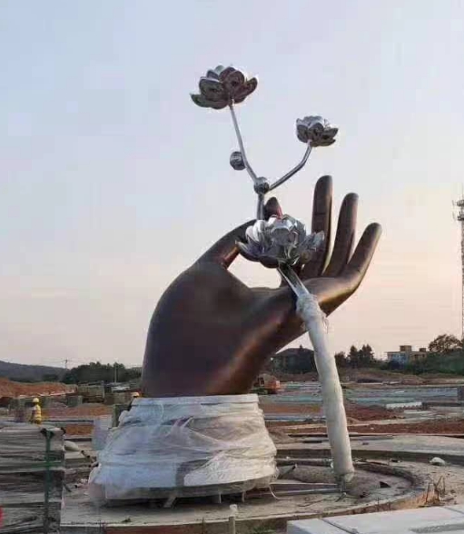 hand holds flower metal sculpture (3)