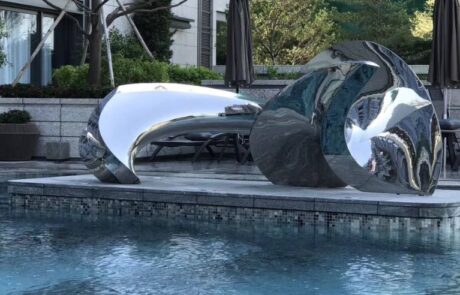 modern pool stainless steel sculpture
