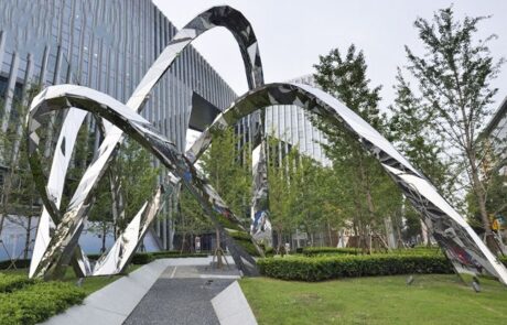 Park green Spaces interspersed with tall metal designs Mirror Stainless Steel lin art Sculpture