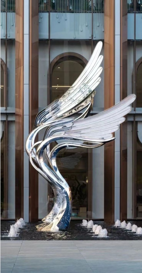 polished stainless steel wings sculpture