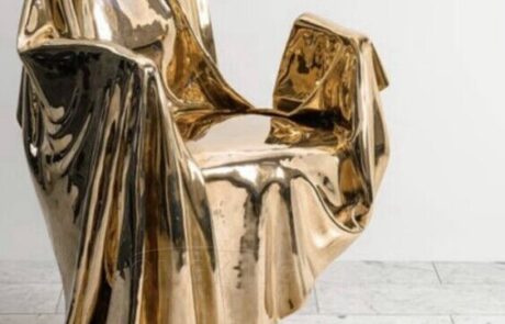golden plated chair sculpture